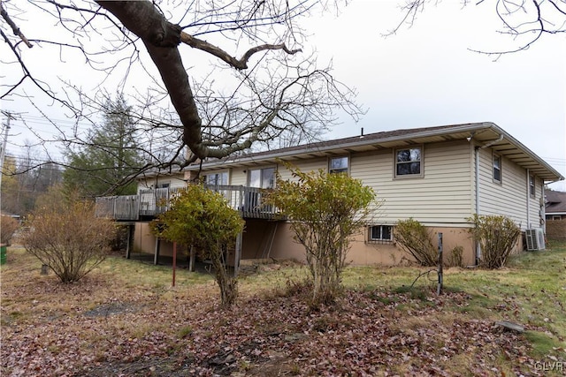 back of property with a wooden deck