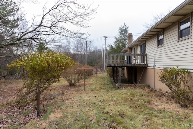 view of yard with a wooden deck