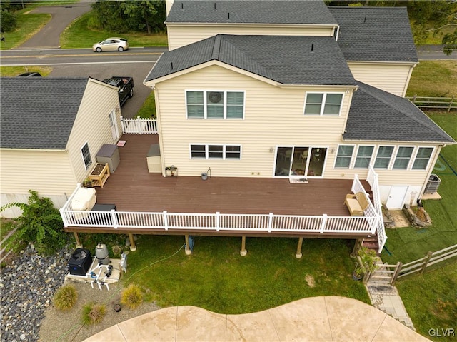 back of property featuring a wooden deck