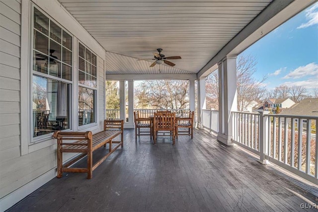 sunroom / solarium featuring ceiling fan