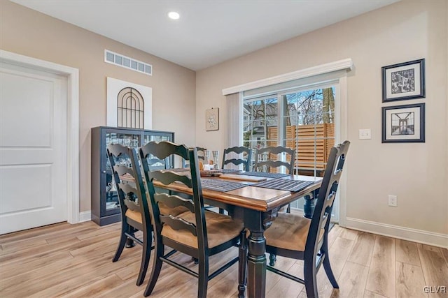 dining room featuring light hardwood / wood-style flooring