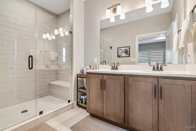 bathroom with vanity and an enclosed shower