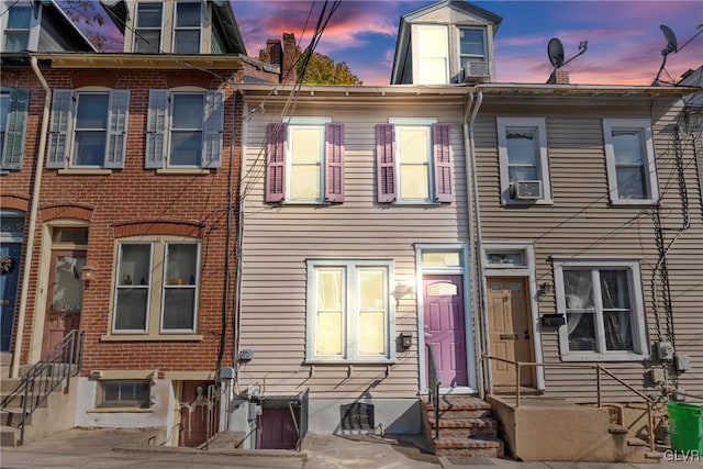 view of front of home featuring cooling unit