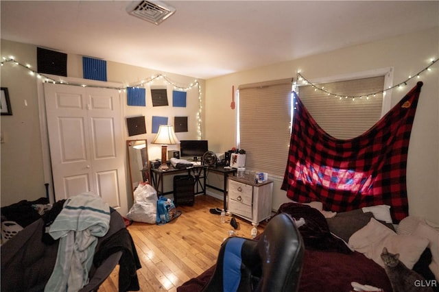 bedroom with light hardwood / wood-style floors