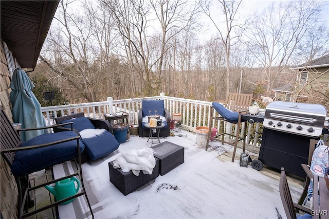 wooden deck featuring a grill