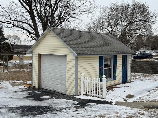 view of snow covered garage