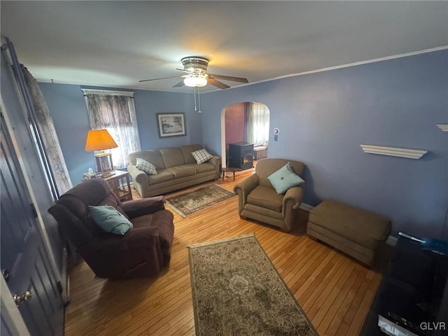 living room featuring hardwood / wood-style flooring and ceiling fan