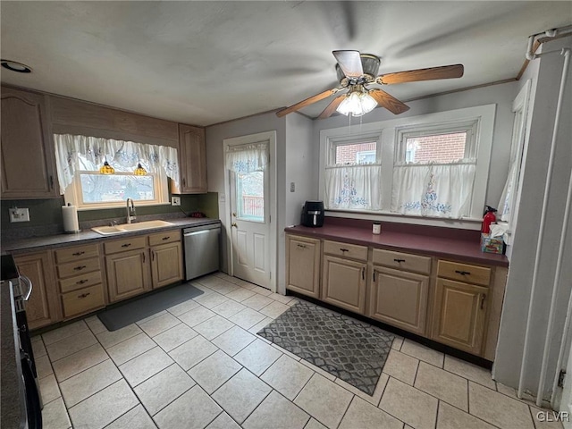 kitchen featuring light tile patterned flooring, appliances with stainless steel finishes, sink, and ceiling fan