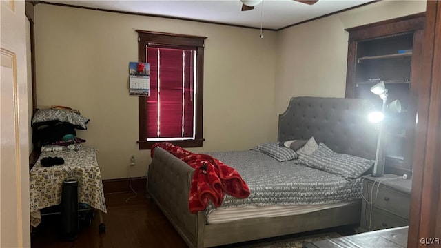 bedroom featuring dark wood-type flooring and ceiling fan