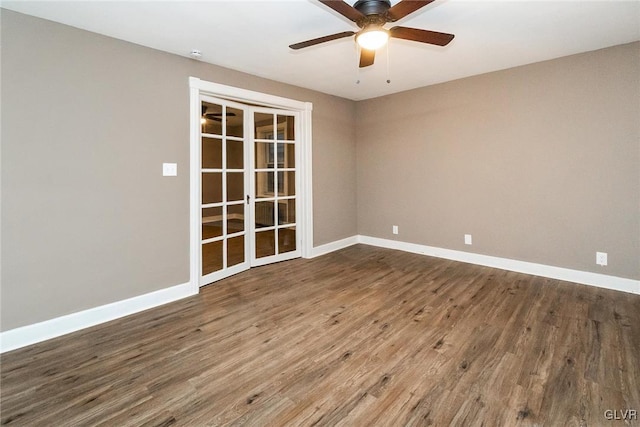 spare room with wood-type flooring, french doors, and ceiling fan