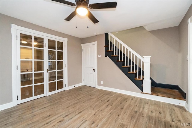 interior space featuring ceiling fan and light wood-type flooring