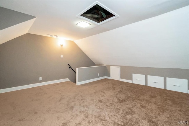 additional living space featuring lofted ceiling and carpet floors