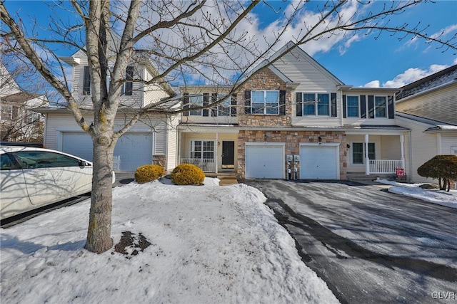 view of front of property with a garage and covered porch