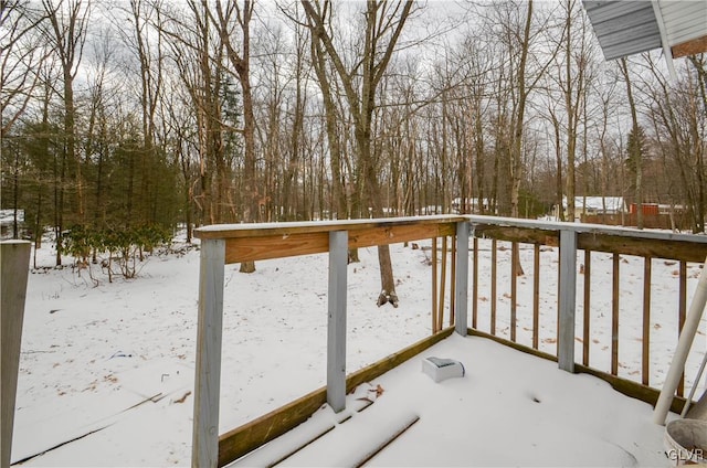 view of snow covered deck