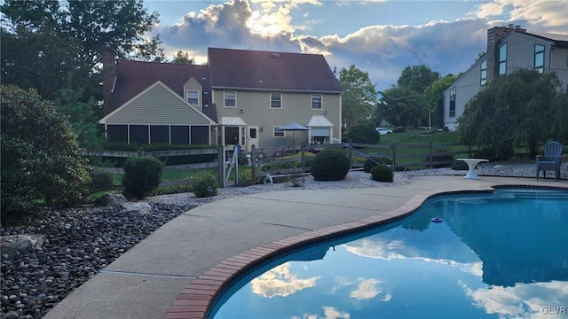 view of swimming pool featuring a patio area