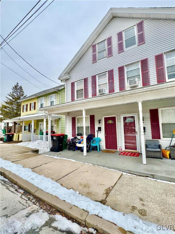 townhome / multi-family property featuring a porch