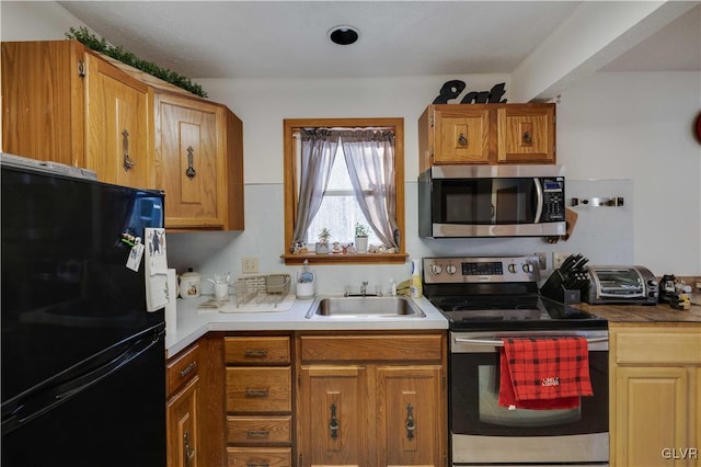 kitchen featuring appliances with stainless steel finishes and sink