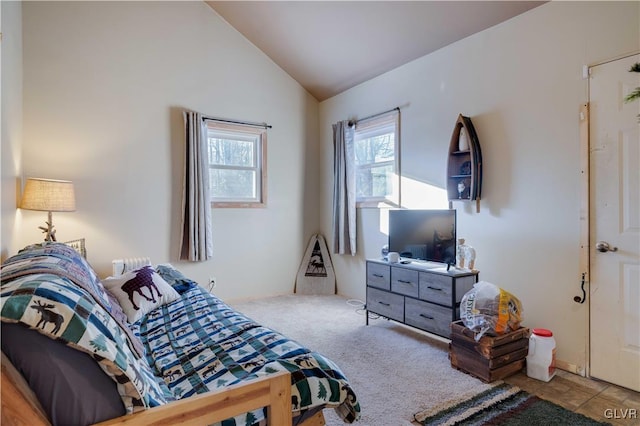 carpeted bedroom featuring lofted ceiling