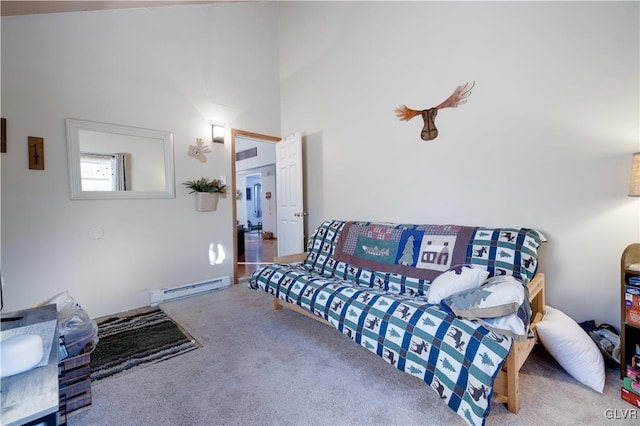 carpeted living room with a towering ceiling and a baseboard heating unit