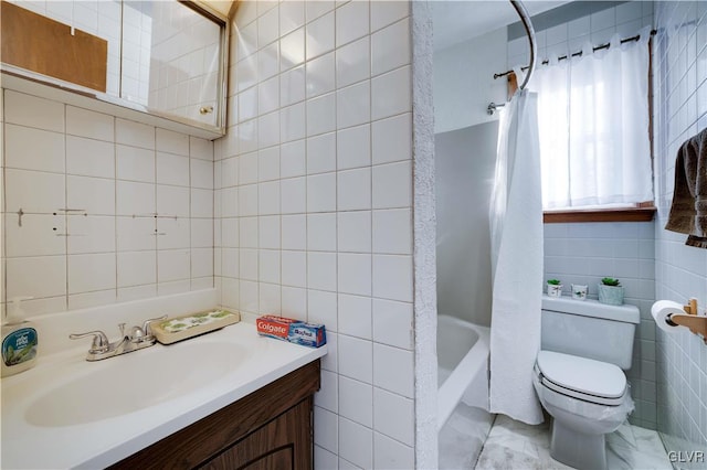 full bathroom featuring vanity, tile walls, shower / bath combination with curtain, and toilet