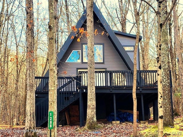 rear view of property with a deck