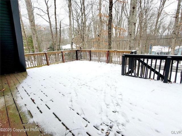 view of snow covered deck