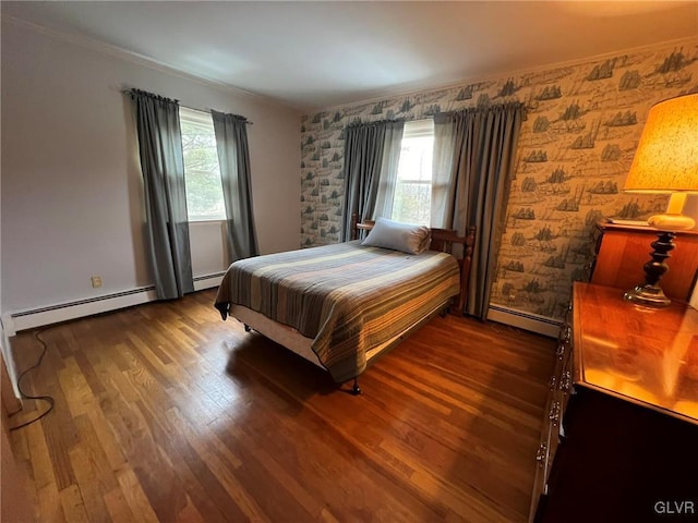 bedroom featuring baseboard heating and dark hardwood / wood-style floors