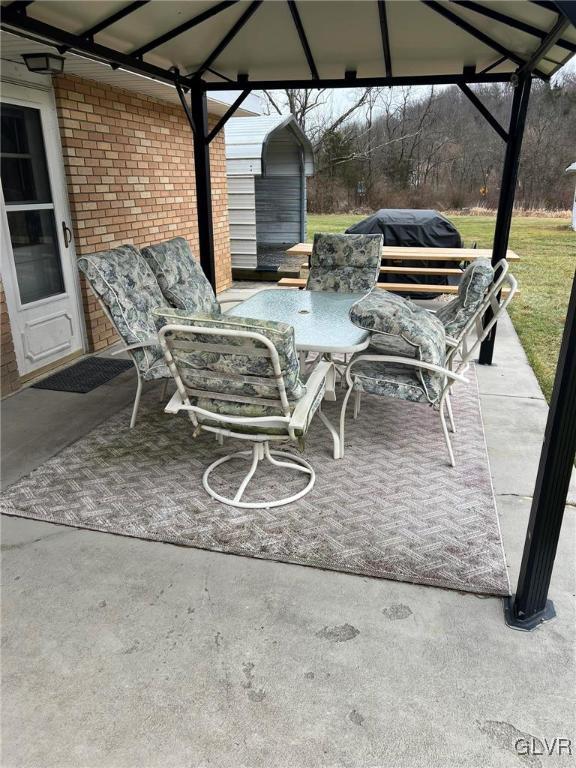 view of patio / terrace featuring a grill and a gazebo