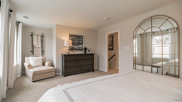 bedroom featuring light carpet