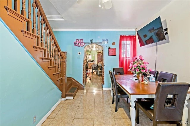 tiled dining room with crown molding