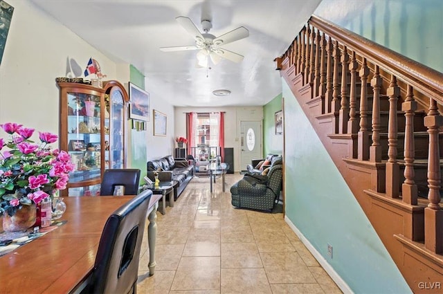 interior space with ceiling fan