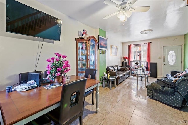 tiled living room featuring ceiling fan