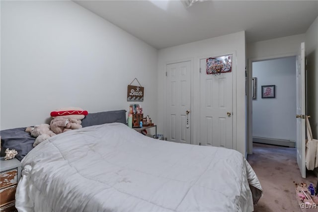 carpeted bedroom featuring a baseboard heating unit