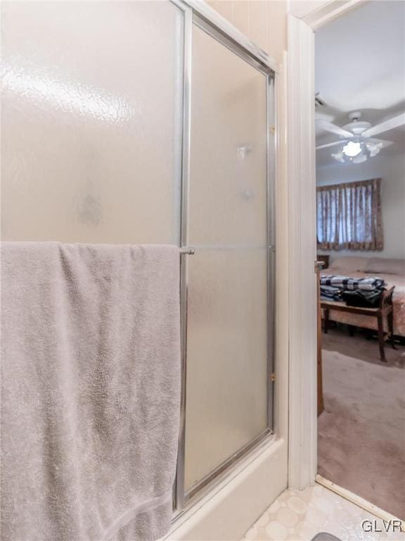 bathroom with walk in shower and ceiling fan