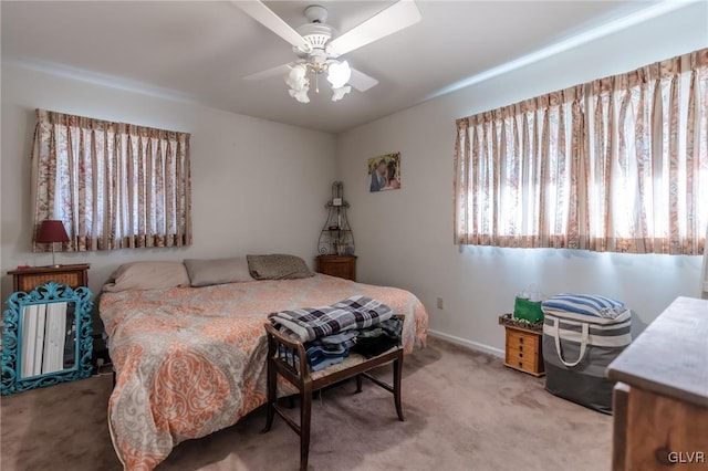 bedroom featuring ceiling fan and light colored carpet