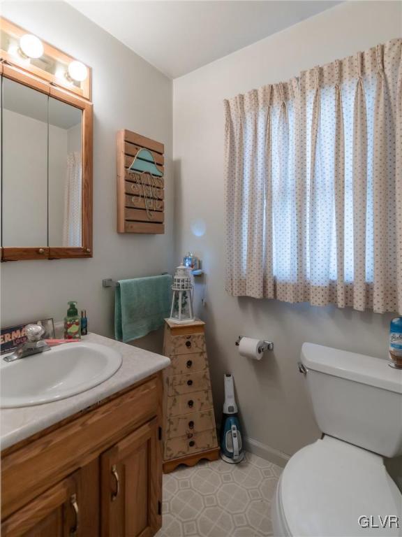 bathroom with vanity and toilet