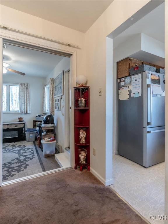 interior space featuring light colored carpet