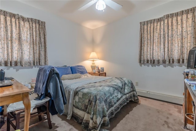 bedroom with a baseboard radiator, carpet floors, and ceiling fan