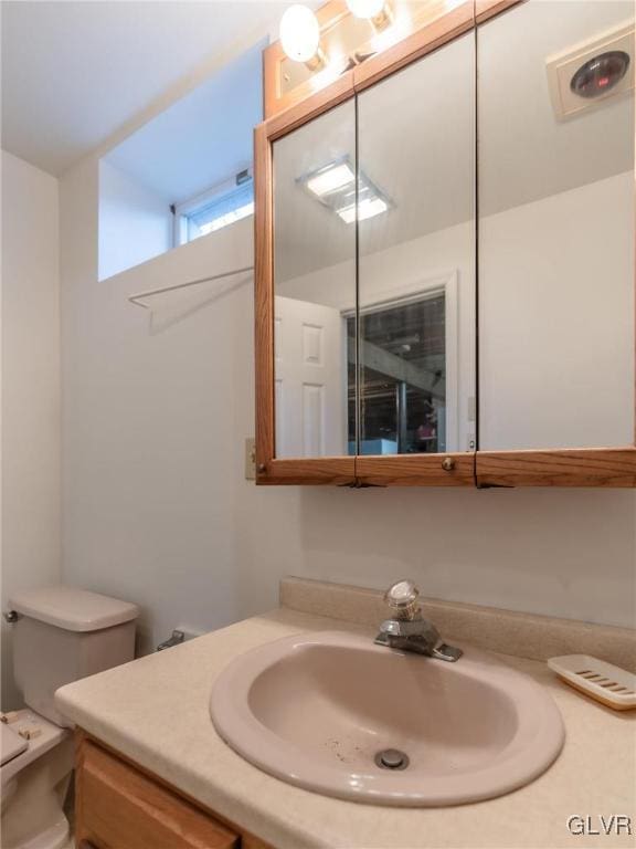 bathroom with vanity and toilet