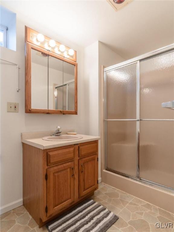 bathroom with vanity and walk in shower