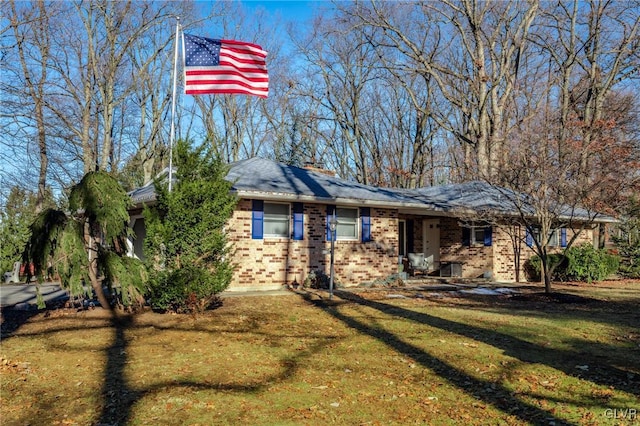 ranch-style house with a front lawn