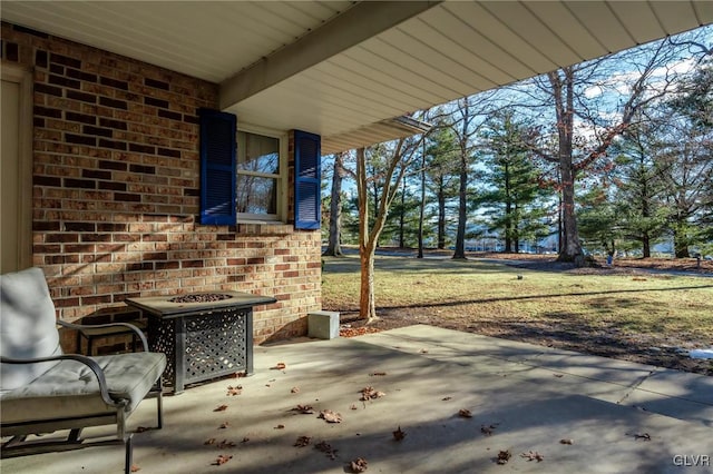 view of patio / terrace with a fire pit