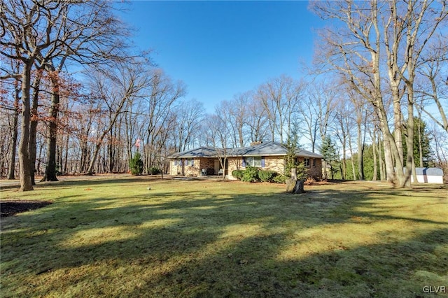 ranch-style house with a front yard