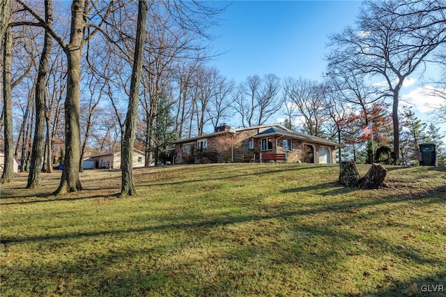 view of front of home with a garage and a front yard