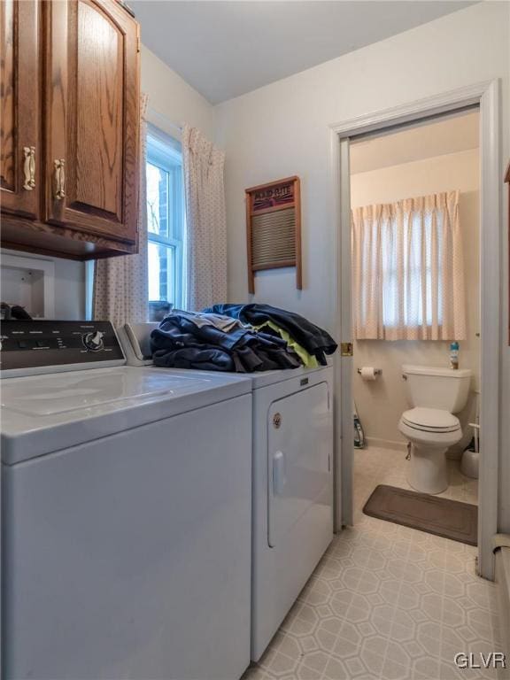 laundry area with a wall mounted air conditioner and washing machine and dryer