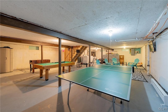 playroom featuring billiards, a baseboard radiator, and concrete floors