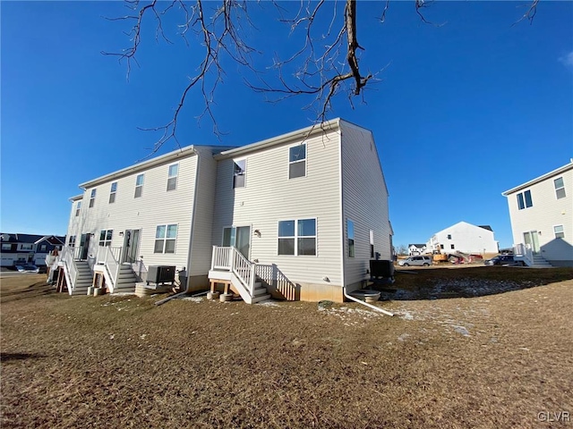 back of house featuring cooling unit