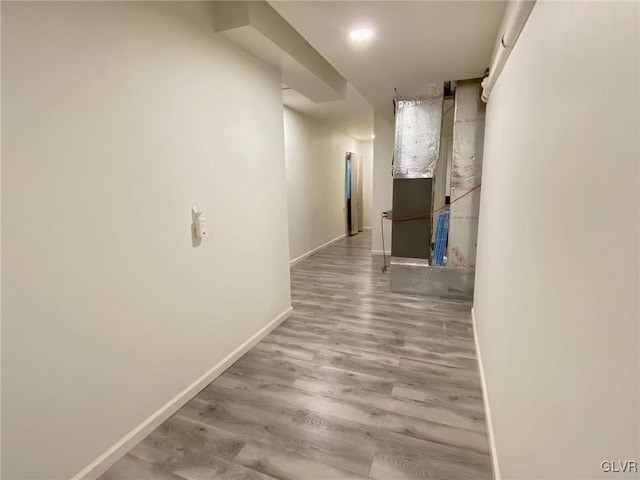 hallway with light hardwood / wood-style flooring