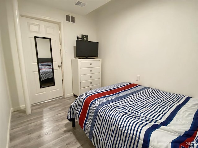 bedroom featuring light hardwood / wood-style floors