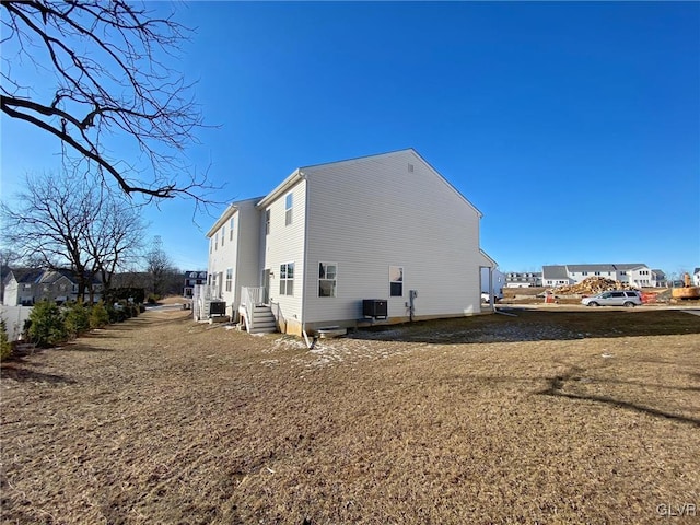 view of home's exterior with central AC unit